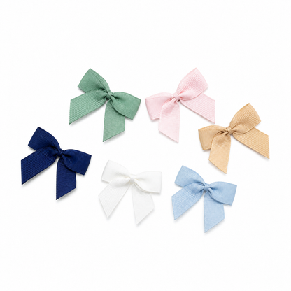 Six 5cm grosgrain ribbon bows in sage green, blush pink, champagne gold, navy, ivory and pale blue