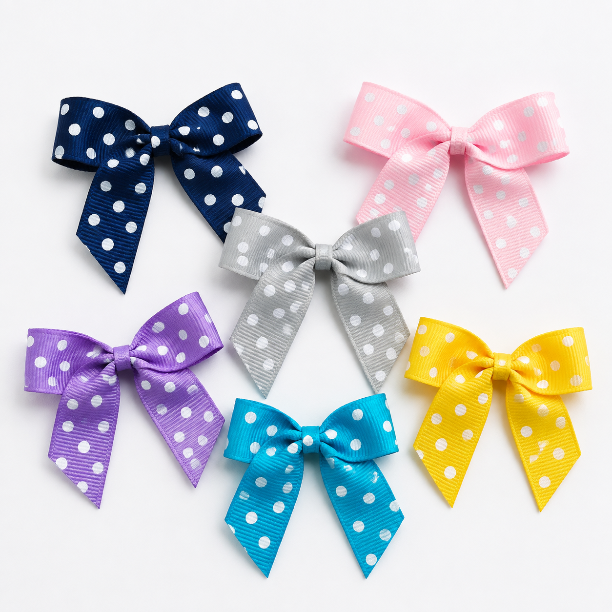 Six 5cm polka dot grosgrain ribbon bows in navy, pink, silver, lilac, turquoise and yellow