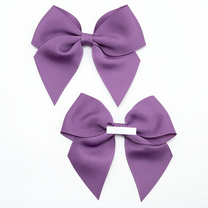 Front and back of amethyst 10cm grosgrain bow showing the self-adhesive strip