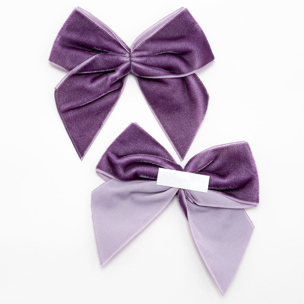 Front and back of amethyst 10cm velvet bows showing the self-adhesive strip
