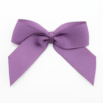 Amethyst 5cm self-adhesive grosgrain ribbon bow on a white background