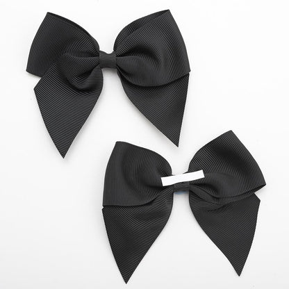 Front and back of black 10cm grosgrain bow showing the self-adhesive strip