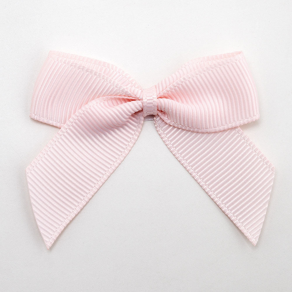 Blush Pink 5cm self-adhesive grosgrain ribbon bow on a white background
