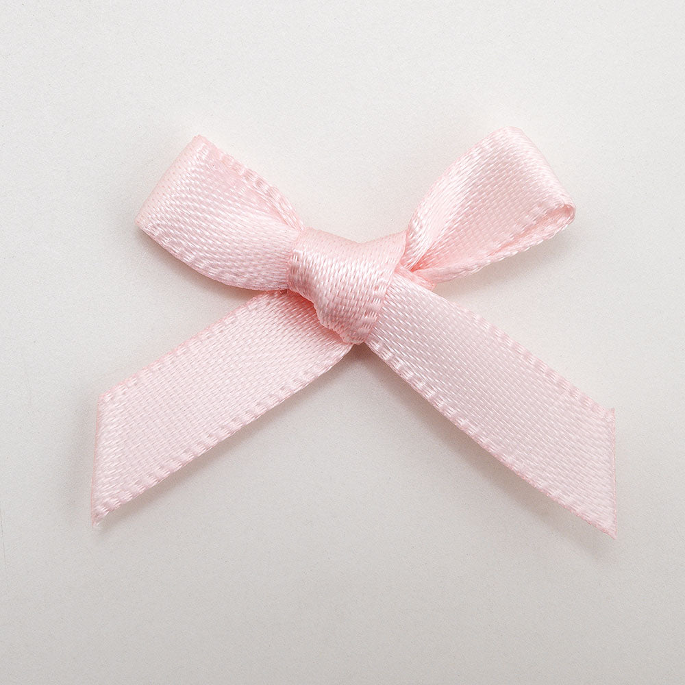 Blush pink mini satin ribbon bows supplied in a pack of 100