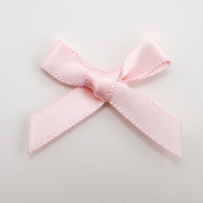 Blush pink mini satin ribbon bows supplied in a pack of 100