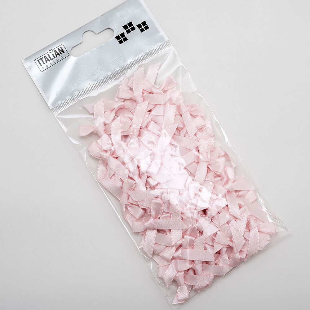 Loose blush pink mini satin ribbon bows showing their size and shape