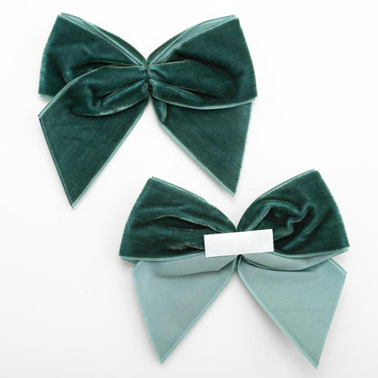 Front and back of bottle green 10cm velvet bows showing the self-adhesive strip