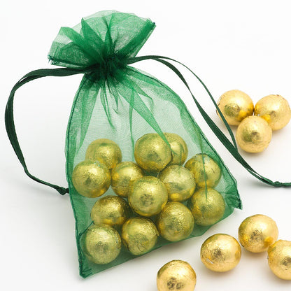 Bottle Green organza wedding favour bag filled with sweets
