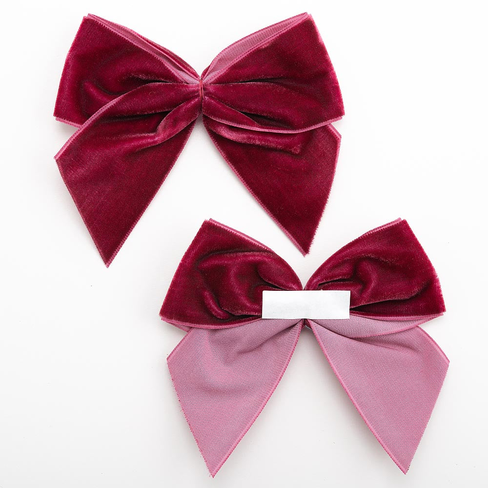 Front and back of burgundy 10cm velvet bows showing the self-adhesive strip