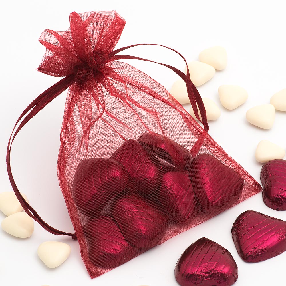 Burgundy organza wedding favour bag filled with sweets