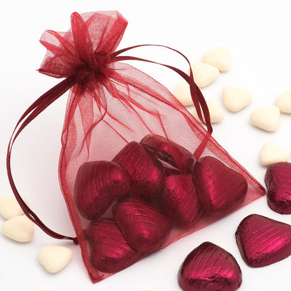 Burgundy organza wedding favour bag filled with sweets