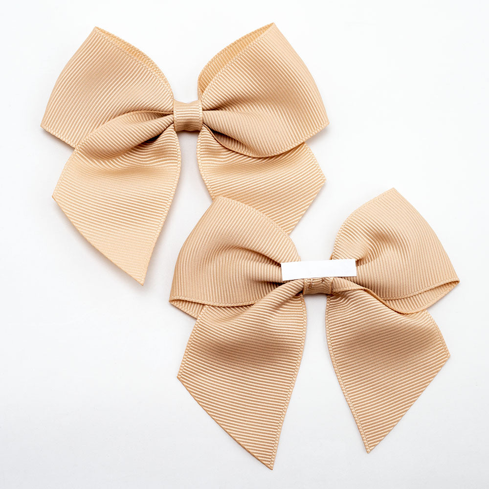Front and back of champagne gold 10cm grosgrain bow showing the self-adhesive strip