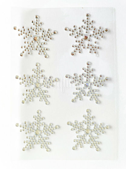Six self adhesive clear snowflake stickers on a sheet