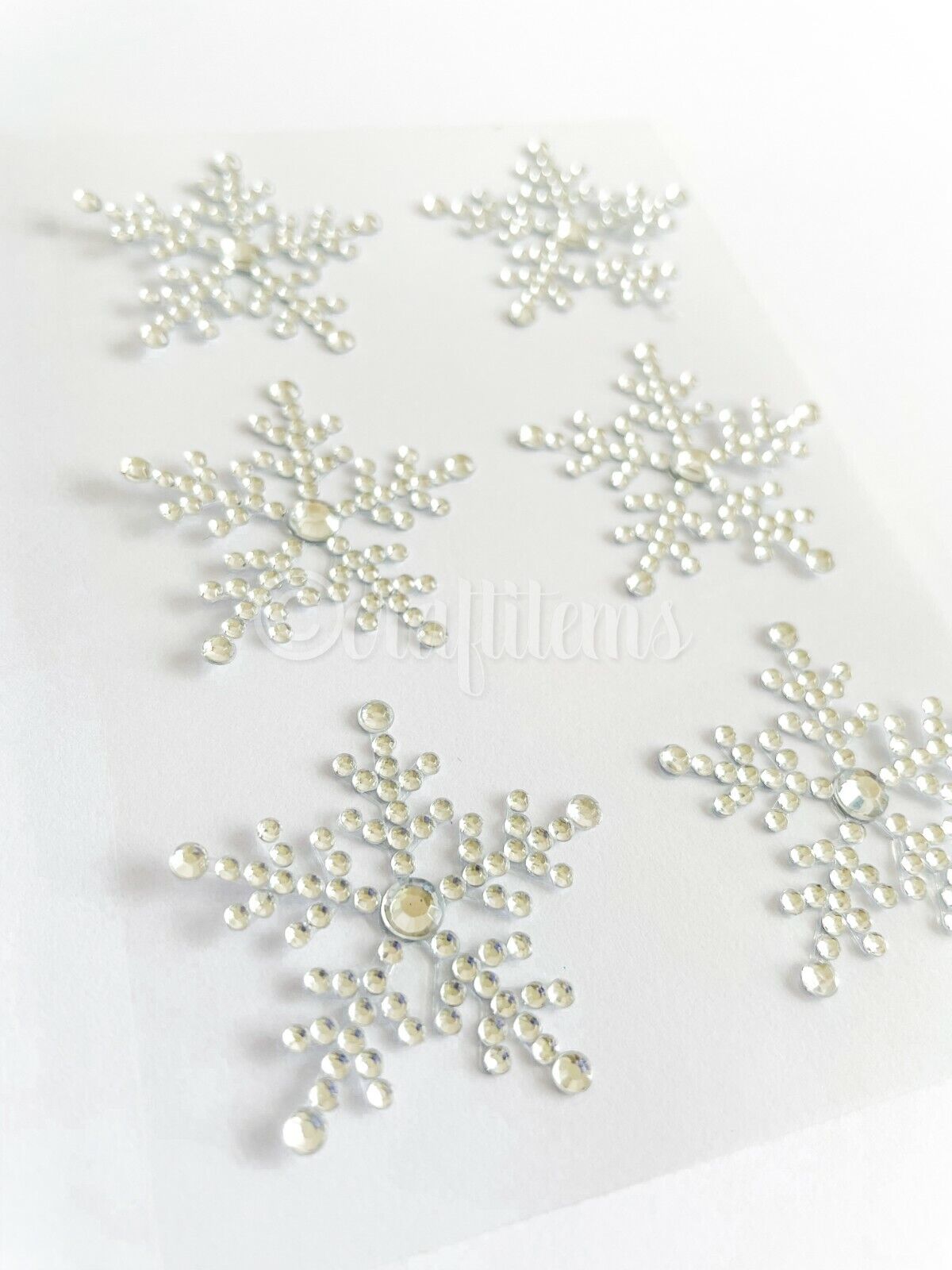 Clear self adhesive snowflake stickers for sticking onto Christmas cards