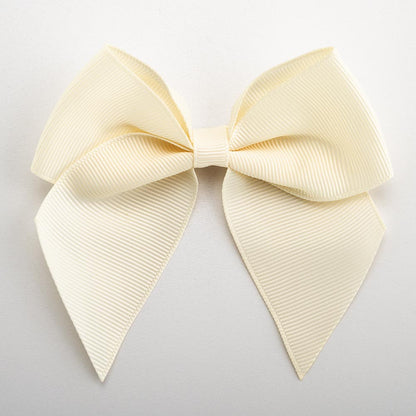 Cream 10cm self-adhesive grosgrain ribbon bow on a white background