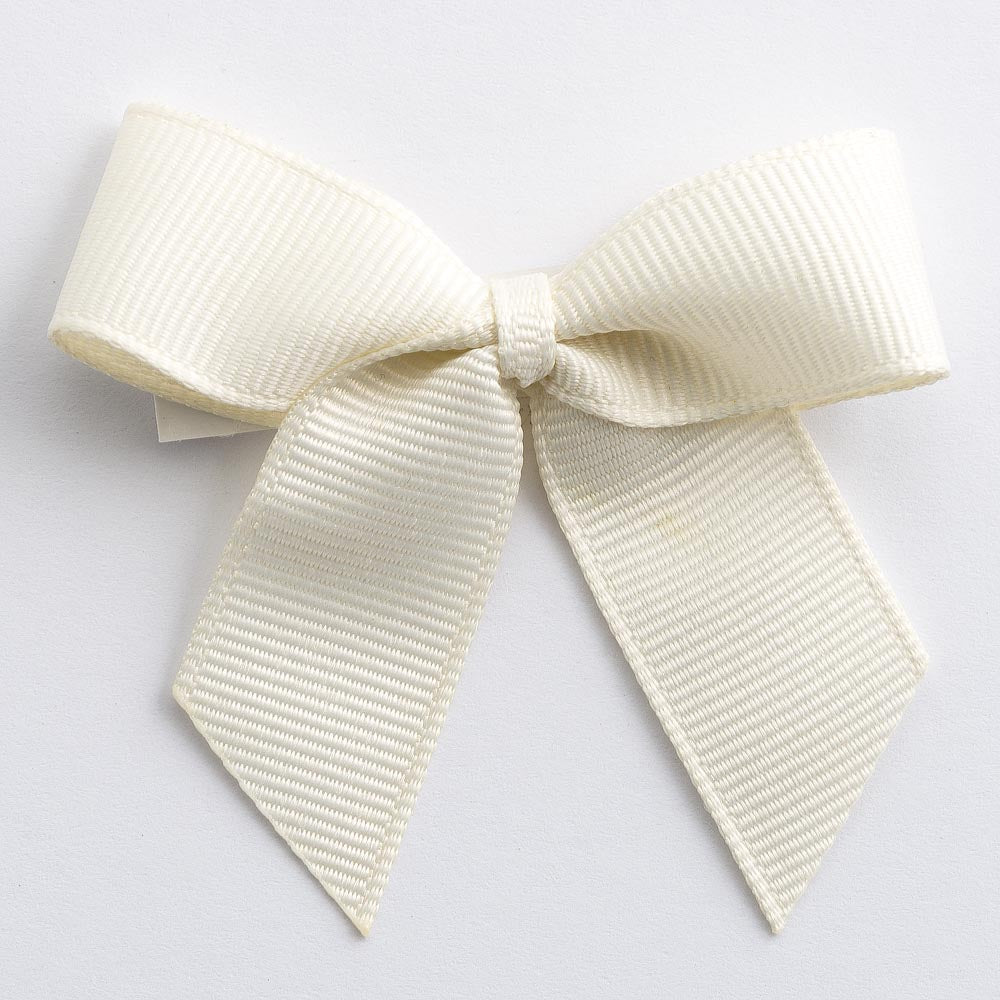 Cream 5cm self-adhesive grosgrain ribbon bow on a white background