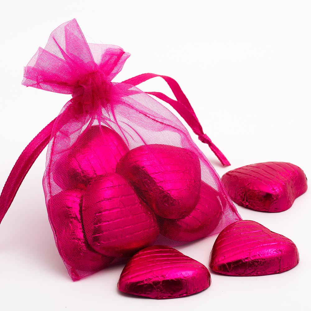 Fuchsia organza wedding favour bag filled with sweets