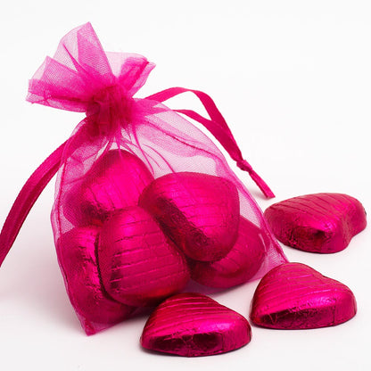 Fuchsia organza wedding favour bag filled with sweets