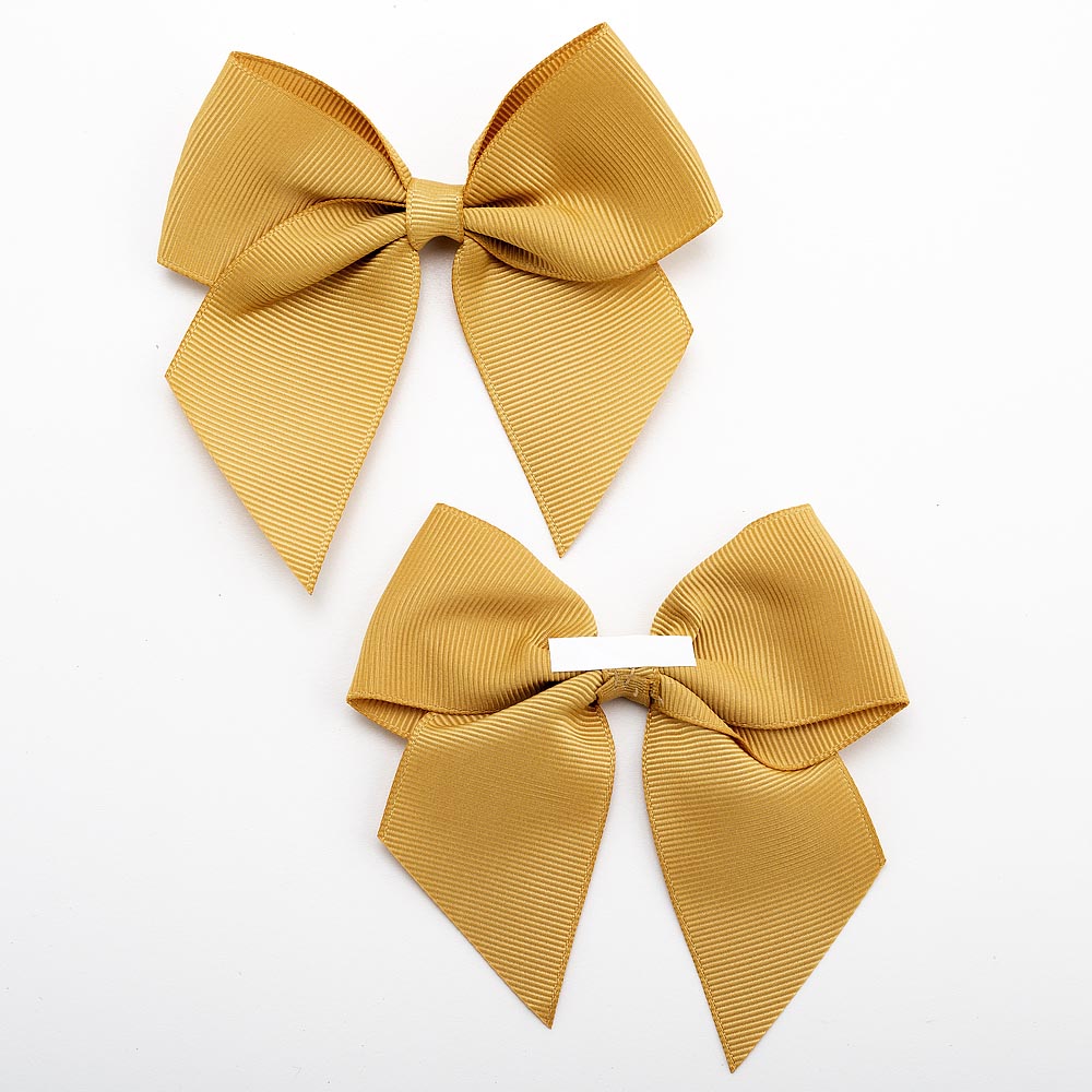 Front and back of gold 10cm grosgrain bow showing the self-adhesive strip