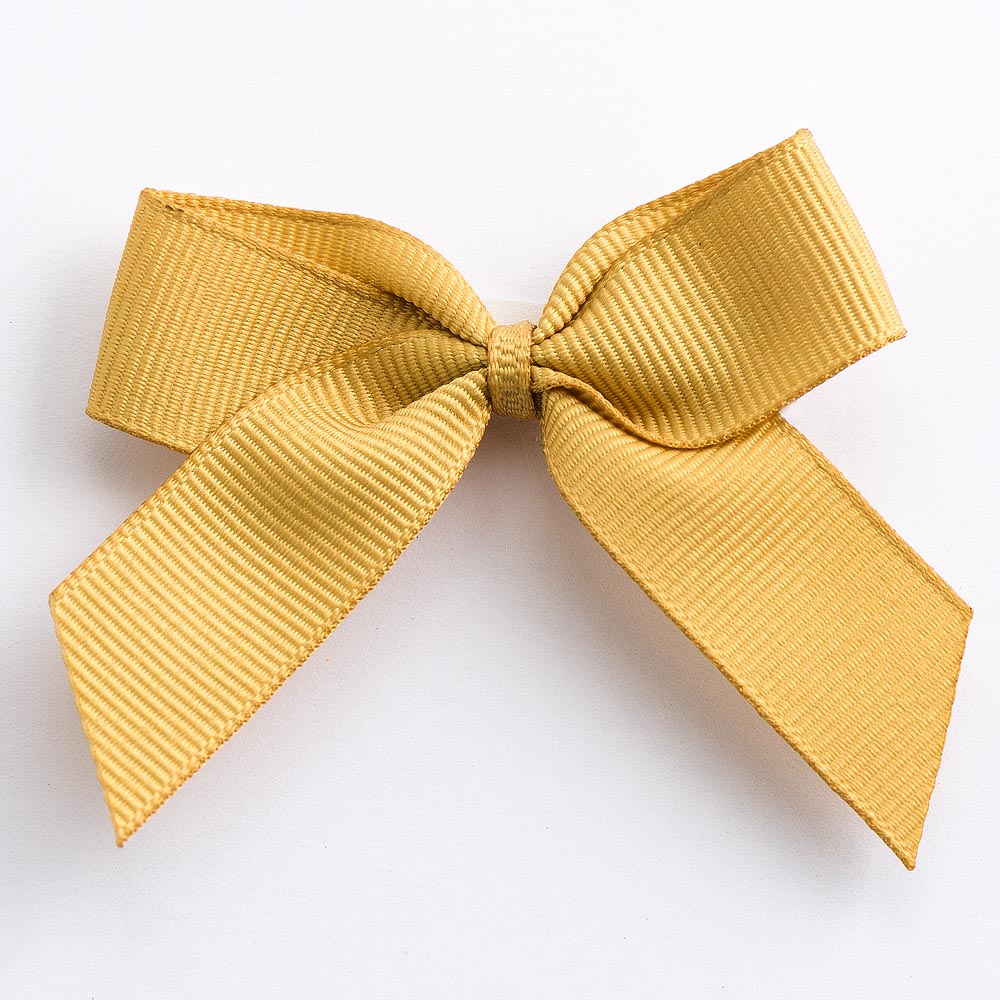 Gold 5cm self-adhesive grosgrain ribbon bow on a white background