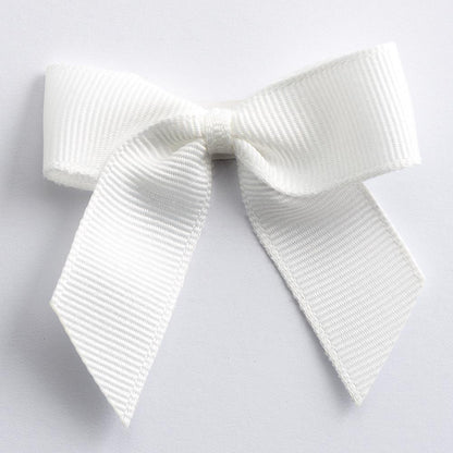 Ivory 5cm self-adhesive grosgrain ribbon bow on a white background
