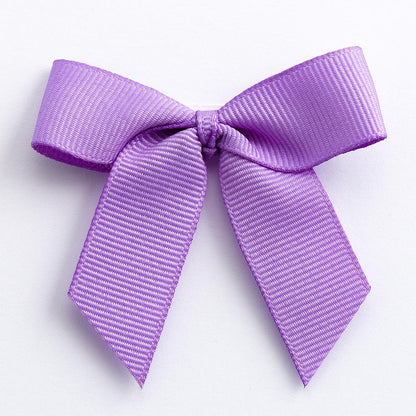Lilac 5cm self-adhesive grosgrain ribbon bow on a white background
