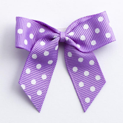 Lilac 5cm polka dot grosgrain ribbon bow on a white background