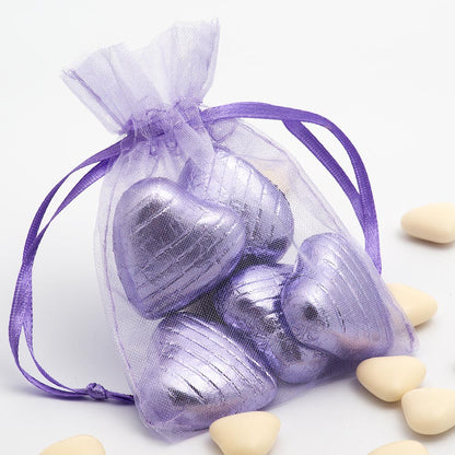 Lilac organza wedding favour bag filled with sweets