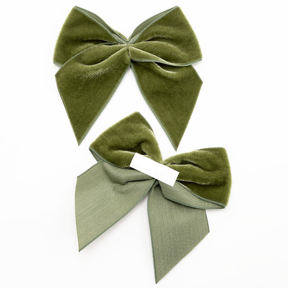 Front and back of moss green 10cm velvet bows showing the self-adhesive strip
