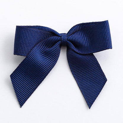 Navy 5cm self-adhesive grosgrain ribbon bow on a white background