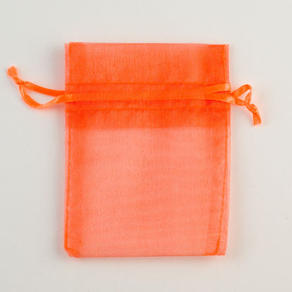 Orange small organza wedding favour bag measuring 7.5 x 10cm