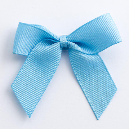 Pale Blue 5cm self-adhesive grosgrain ribbon bow on a white background