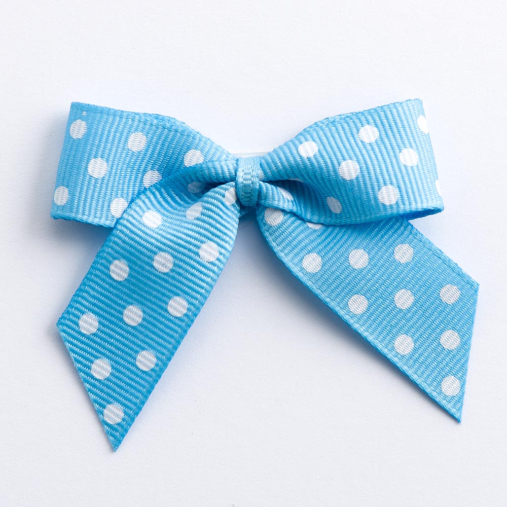 Pale Blue 5cm polka dot grosgrain ribbon bow on a white background