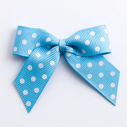Pale Blue 5cm polka dot grosgrain ribbon bow on a white background