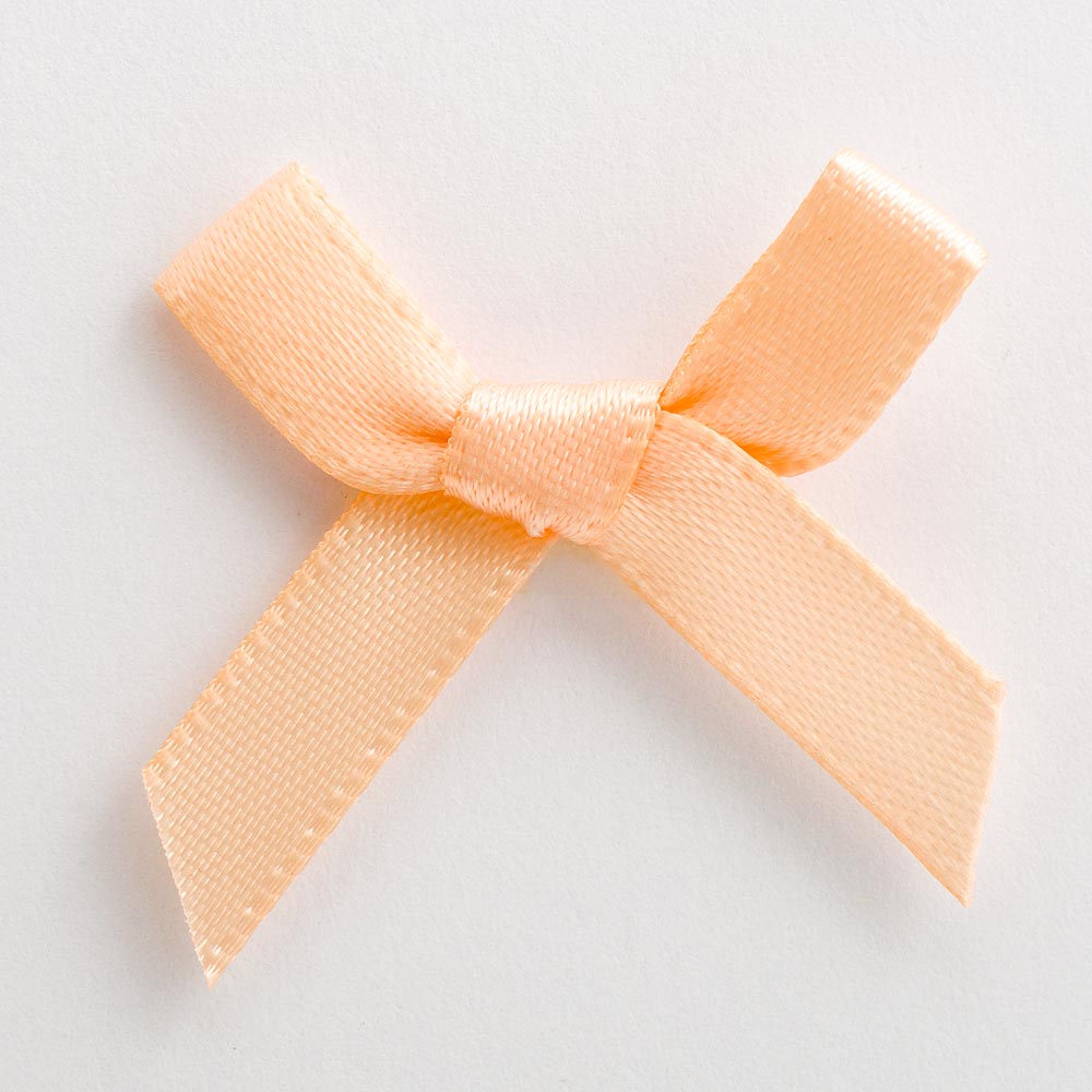 Peach mini satin ribbon bow made from 6mm ribbon, approximately 3cm wide