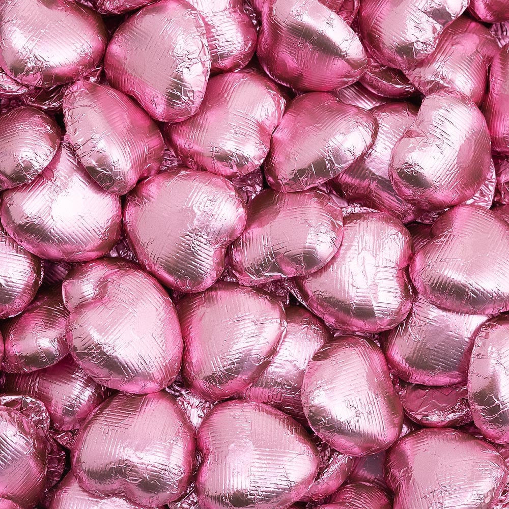 Pink foil heart chocolates for wedding favours and table settings