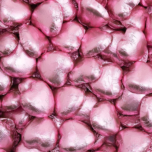 Pink foil heart chocolates for wedding favours and table settings