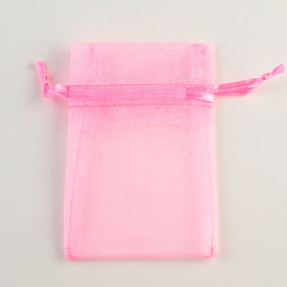 Pink small organza wedding favour bag measuring 7.5 x 10cm