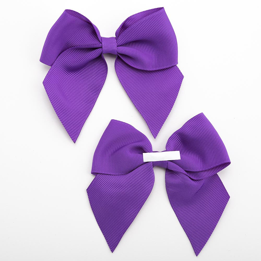 Front and back of purple 10cm grosgrain bow showing the self-adhesive strip