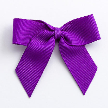 Purple 5cm self-adhesive grosgrain ribbon bow on a white background