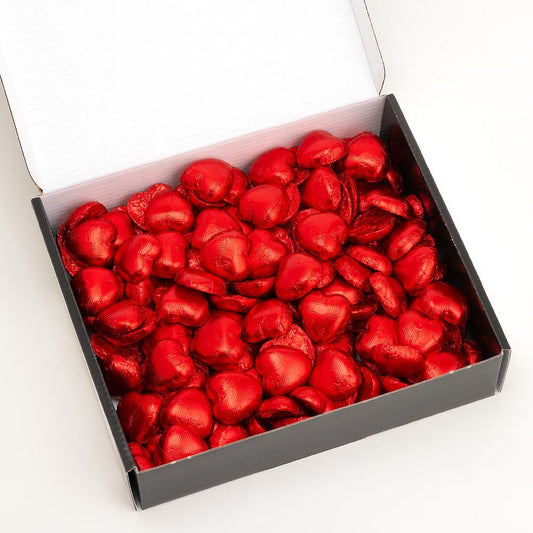 Red foil heart chocolates for wedding favours and table settings