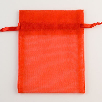 Red organza favour bag measuring 10 x 12.5cm