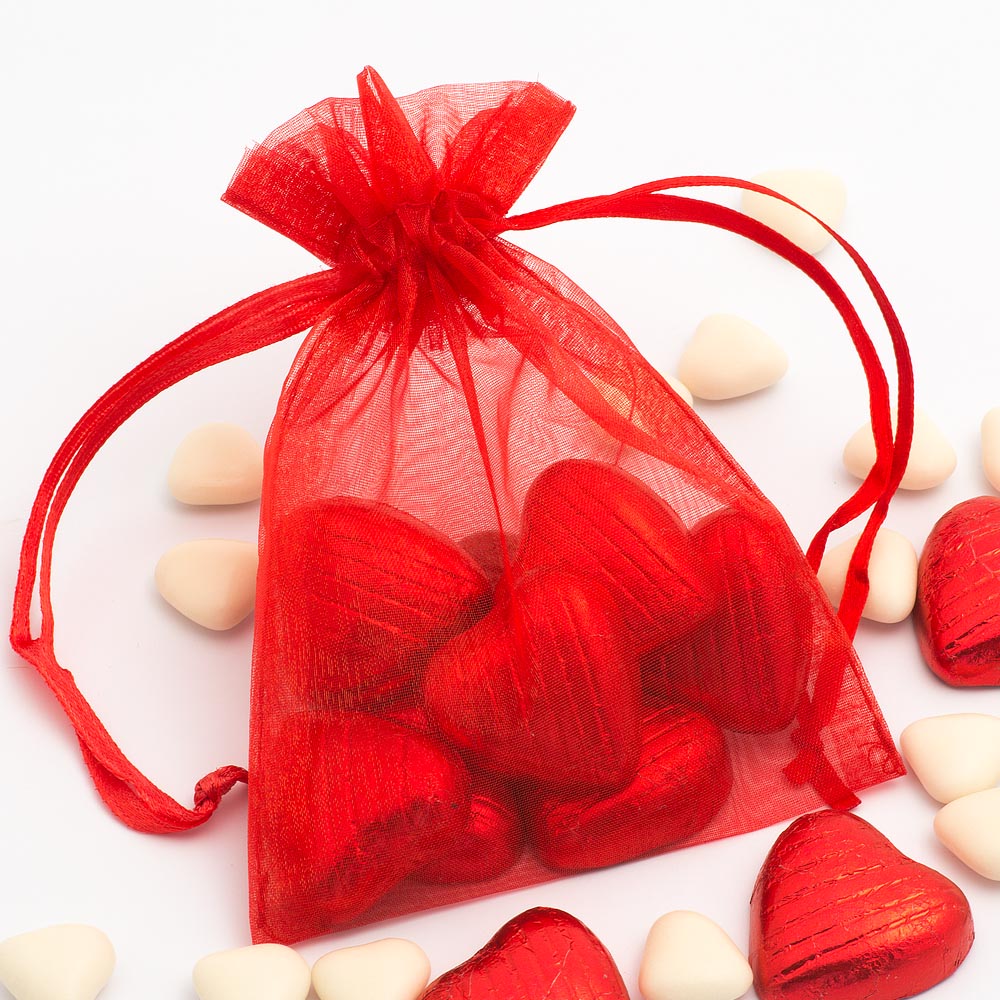 Red organza wedding favour bag filled with sweets