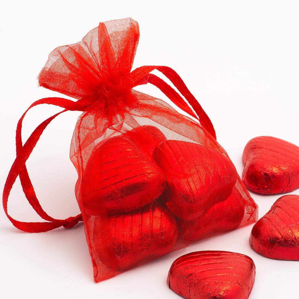 Red organza wedding favour bag filled with sweets