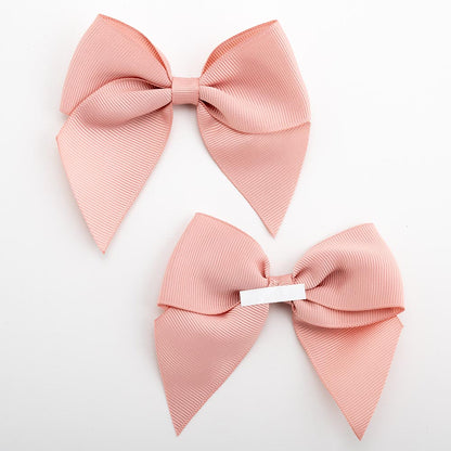 Front and back of rose gold 10cm grosgrain bow showing the self-adhesive strip