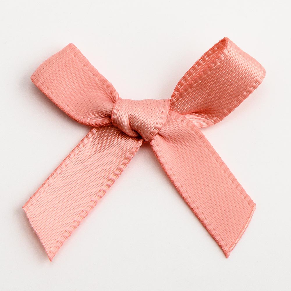 Group of rose gold mini satin ribbon bows approximately 3cm wide