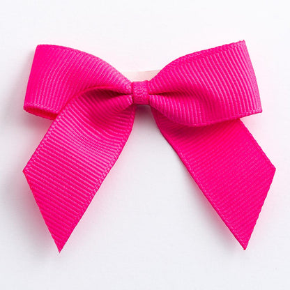 Ruby 5cm self-adhesive grosgrain ribbon bow on a white background