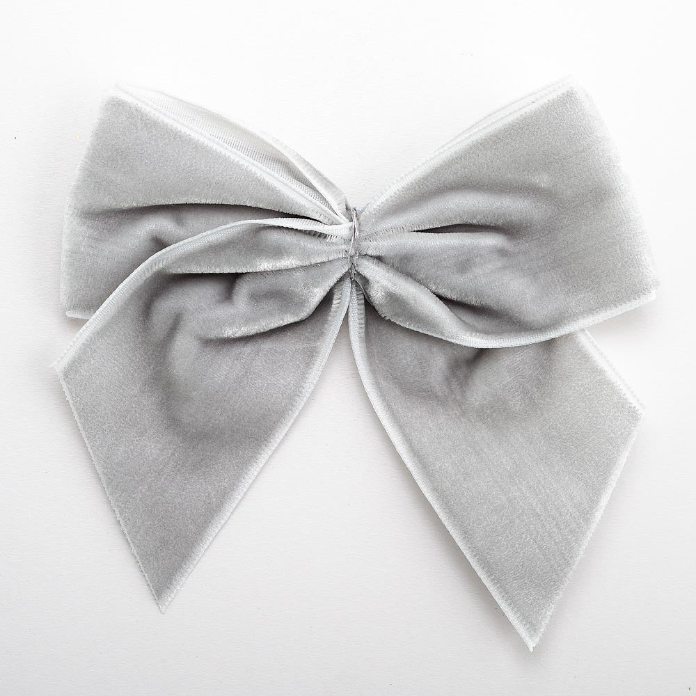 Silver 10cm large self-adhesive velvet ribbon bow on a white background