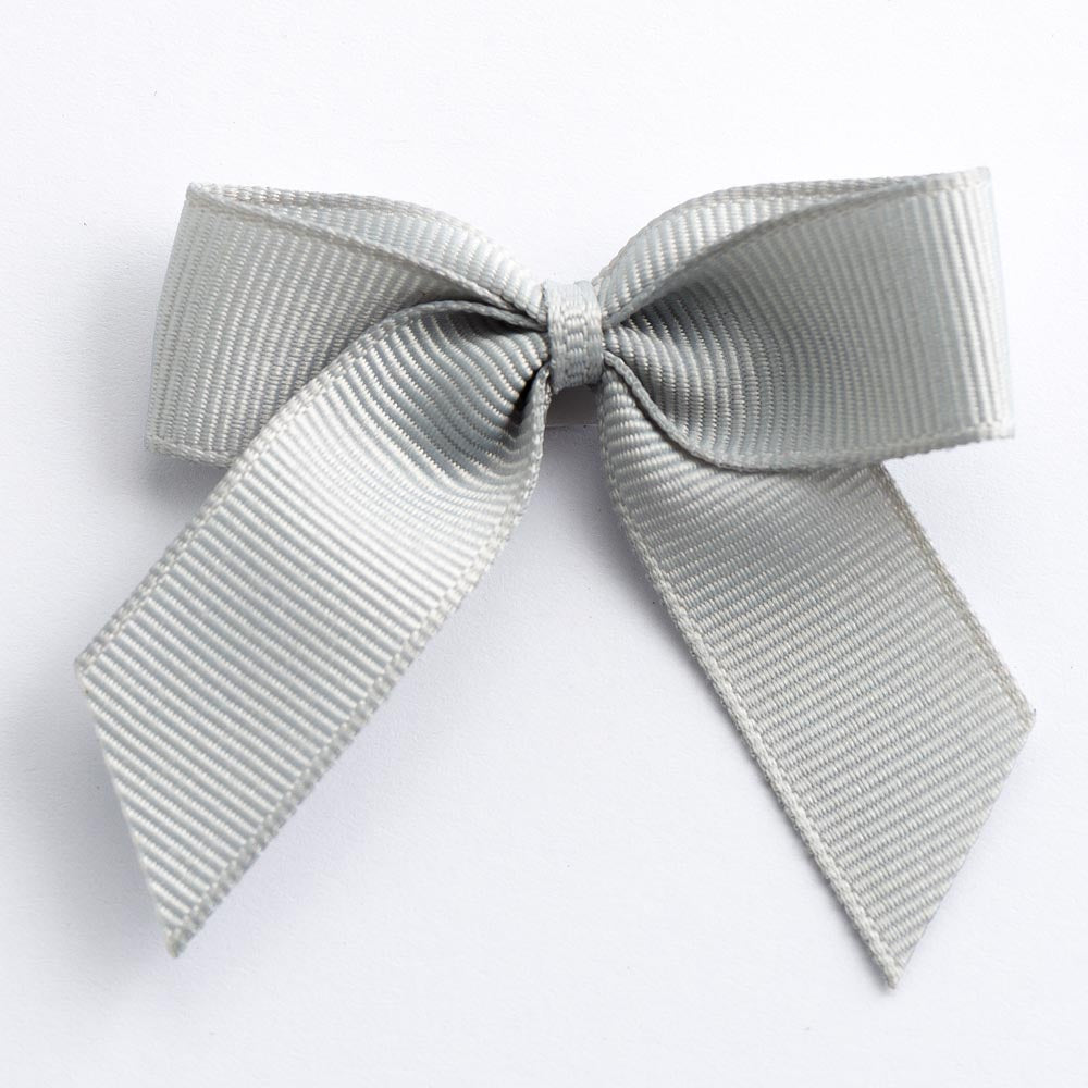 Silver 5cm self-adhesive grosgrain ribbon bow on a white background