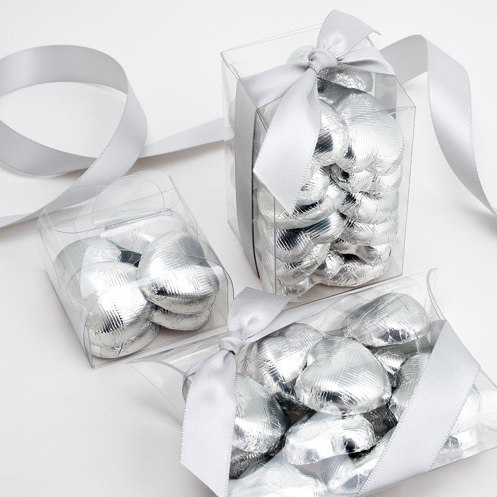 Silver chocolate heart wedding favours displayed in a gift box